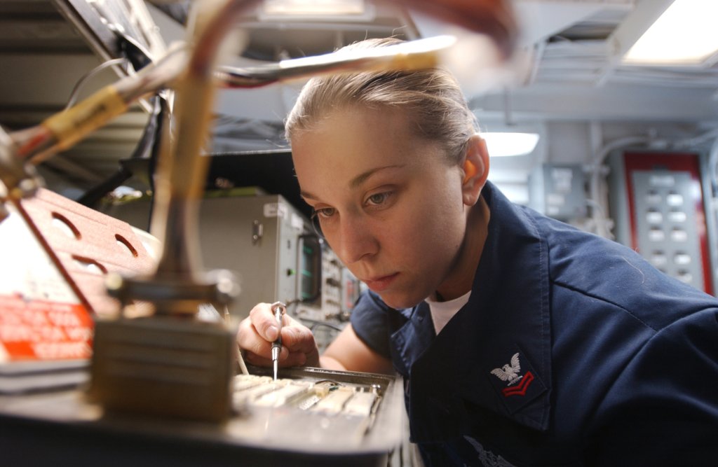Navy Petty Officer 2nd Class Carren McMillan adjusts and aligns an Identification Friend or Foe transponder for an aircraft aboard the USS Theodore Roosevelt (CVN 71) while underway in the Atlantic Ocean on April 3, 2005. Identification Friend or Foe, known as IFF enables a pilot to distinguish enemies in flight. McMillan, of Mission Hills, Calif., is a Navy aviation electronics technician. (DoD photo by Airman Stephen Early, U.S. Navy. (Released))
